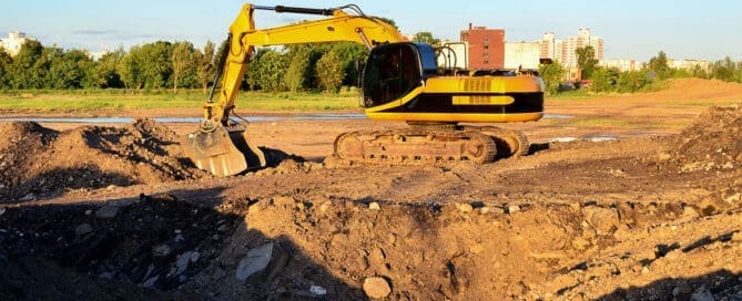 Geotechnical technician measuring soil properties in the field, illustrating post-densification strength improvement over time.