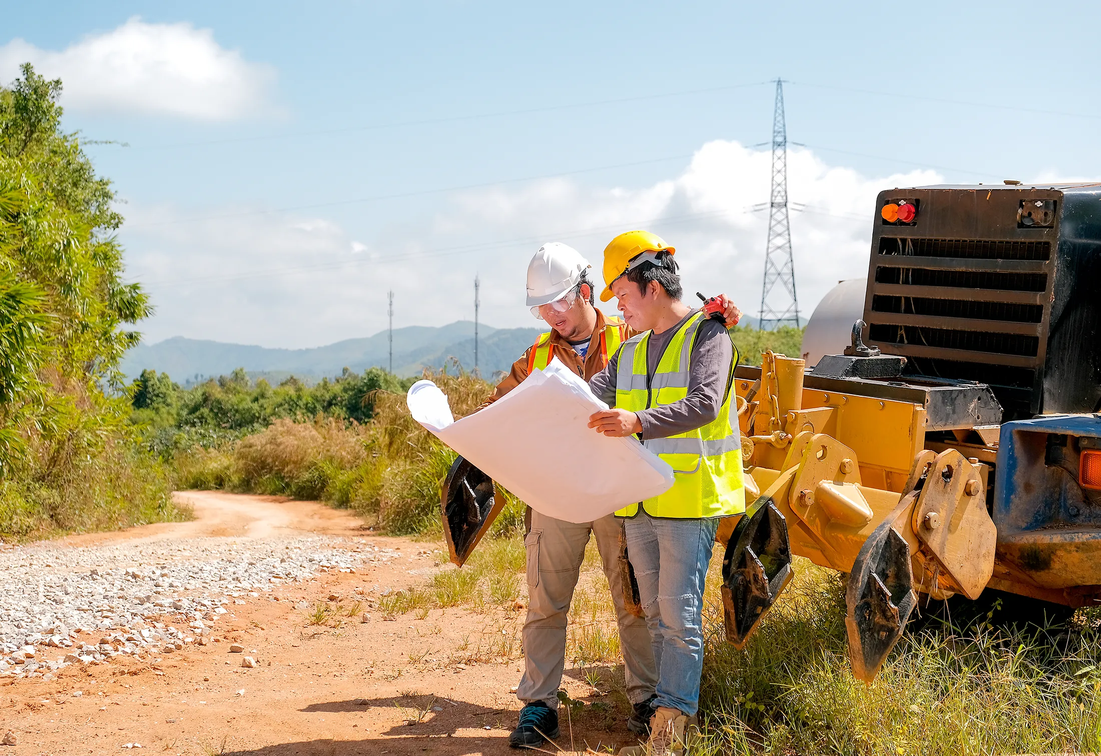 Geotechnical engineer discussing with team member on what next steps in their ground compaction project will be
