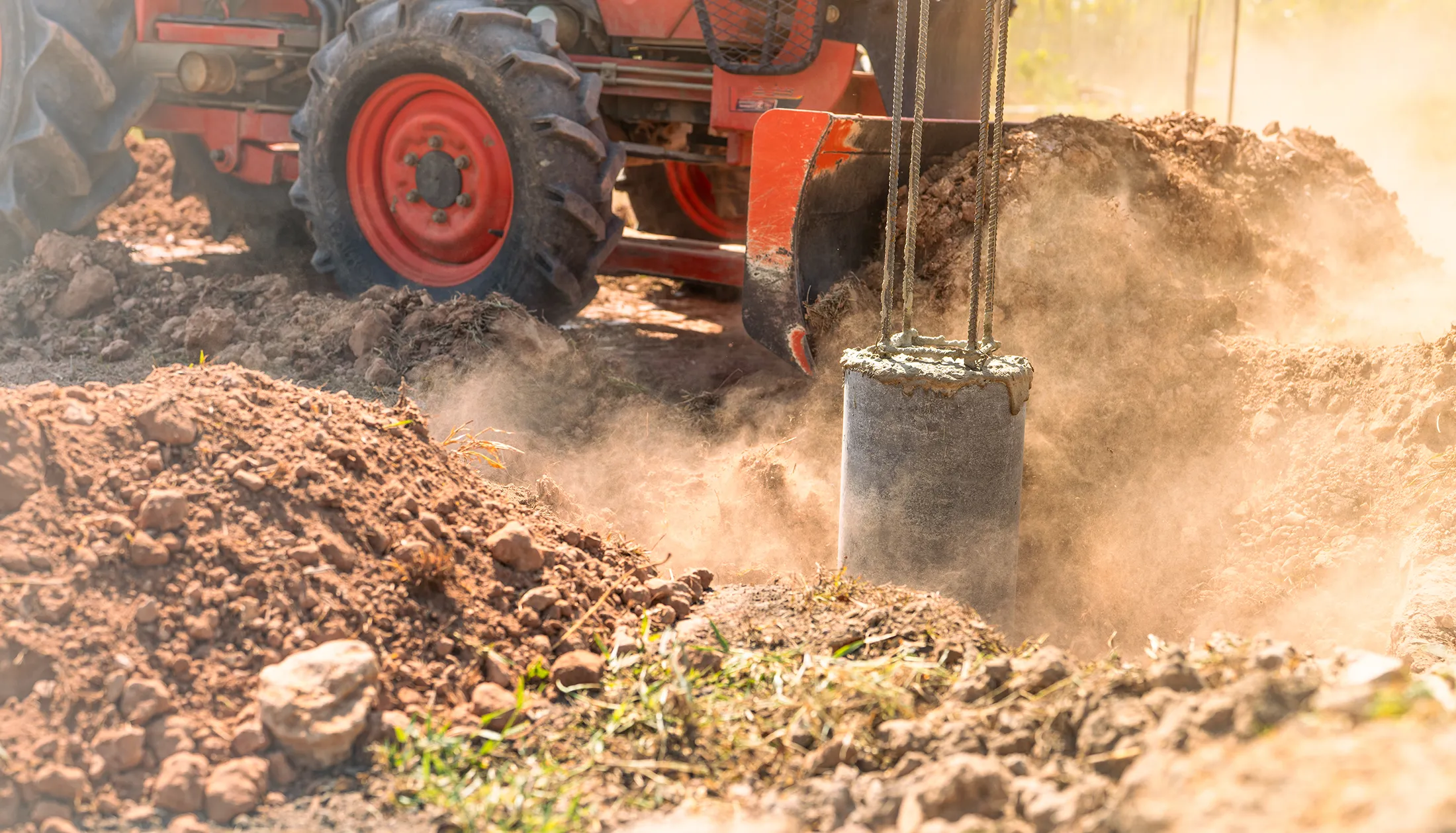 Dynamic compaction equipment compacting soil on a construction site, illustrating vibration monitoring and controlled soil densification for stable ground conditions.