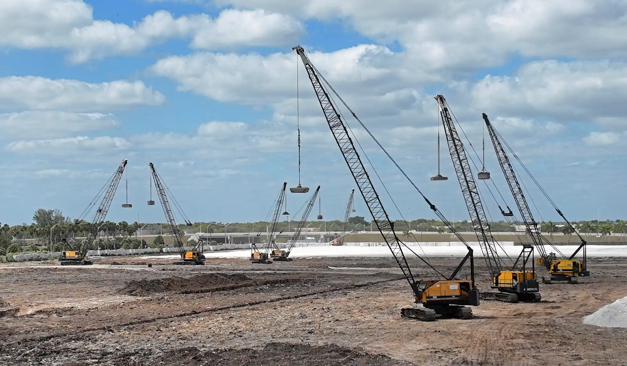 Construction vibration monitoring equipment measuring ground movement during compaction
